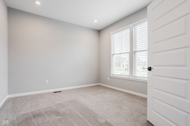 Conveniently located off of the entry hall is a perfect space for a home office or sitting room. | Image 29