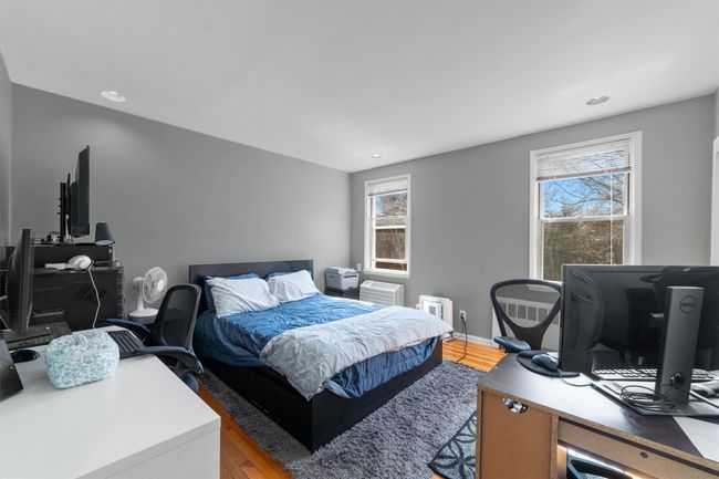 Bedroom featuring baseboards, light wood-style floors, and recessed lighting | Image 17