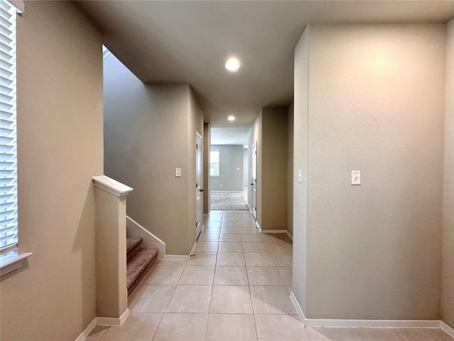 Hall with recessed lighting and light tile patterned floors | Image 4