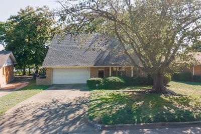 View of front of house with a garage and a front lawn | Image 3