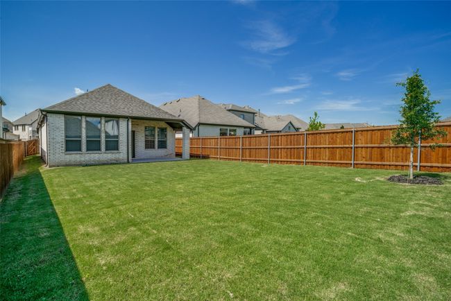 Back of property featuring roof with shingles and brick siding | Image 23