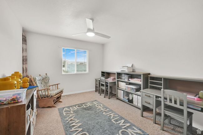Recreation room featuring baseboards, ceiling fan, and carpet floors | Image 14