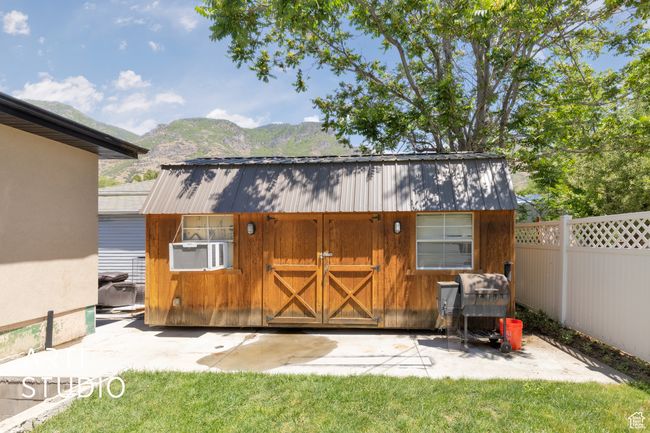 View of outbuilding featuring a mountain view and cooling unit | Image 9