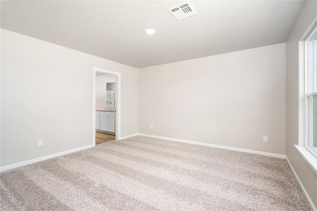 The primary bedroom is spacious with large windows for tons of natural light! | Image 4