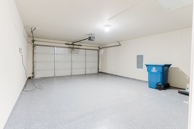 Garage with electric panel and a garage door opener | Image 22