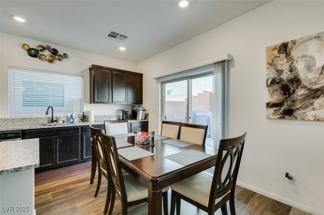 Dining room featuring wood finished floors, recessed lighting, baseboards, and visible vents | Image 14