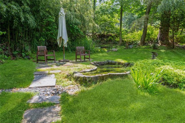 A delightful stream-fed pond is an ideal place to sit and enjoy the surrounding natural beauty. | Image 34