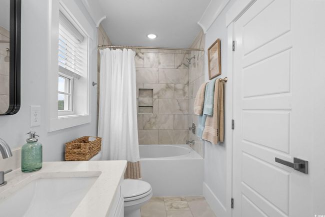 Bathroom with vanity, shower / tub combo with curtain, and recessed lighting | Image 26
