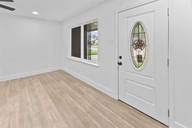Foyer featuring light wood-type flooring, baseboards, ceiling fan, and recessed lighting | Image 23