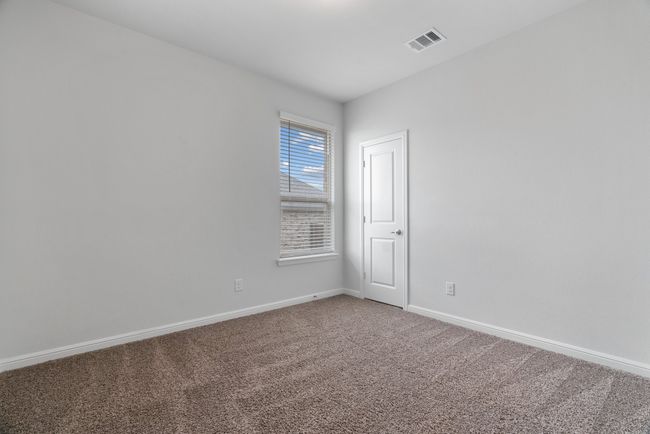 Spare room featuring carpet floors, baseboards, and visible vents | Image 21