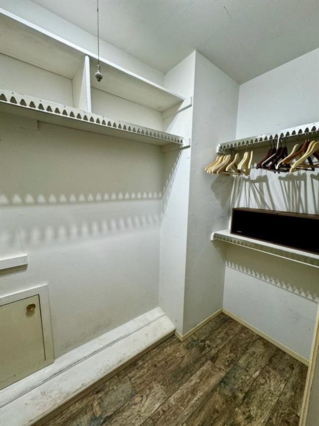 One of several walk-in closets. | Image 42