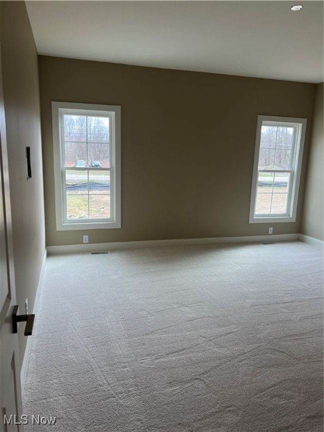Carpeted spare room featuring baseboards | Image 10
