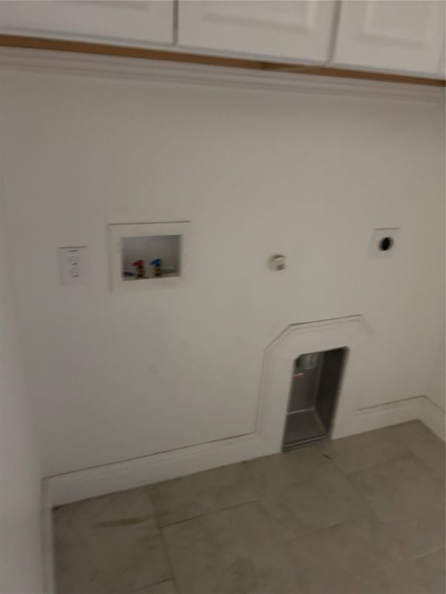 Washroom featuring tile patterned floors, washer hookup, hookup for an electric dryer, and baseboards | Image 22