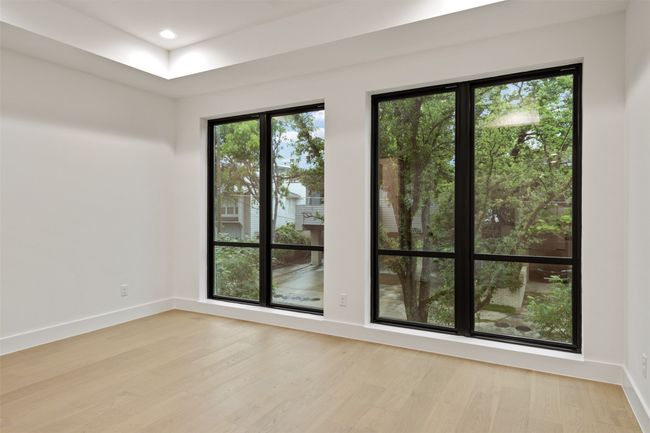 Primary bedroom with floor to ceiling windows | Image 20