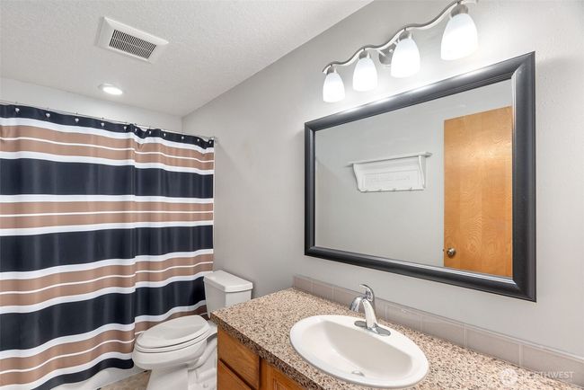 Main floor full bath | Image 16