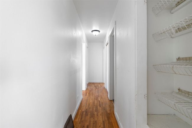 Bright hallway with fresh neutral paint. | Image 40
