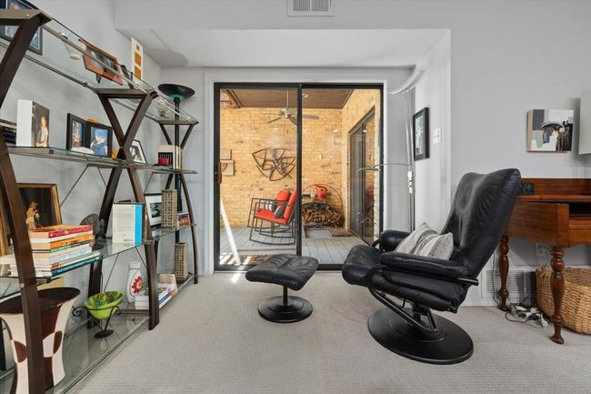 Primary bedroom Sitting Area near Patio Sliding Door. | Image 27