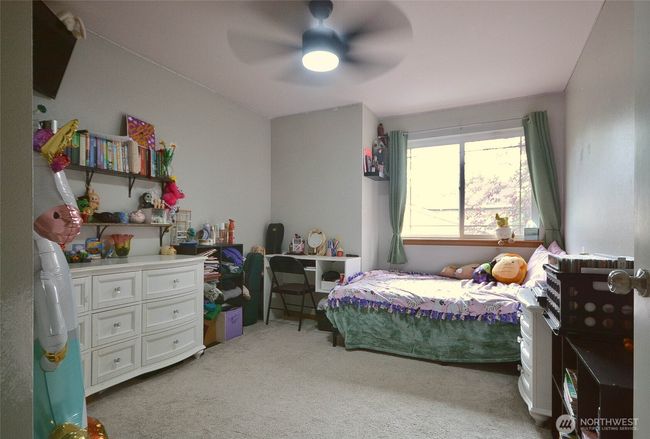 3rd bedroom is spacious, with celling fan. | Image 29