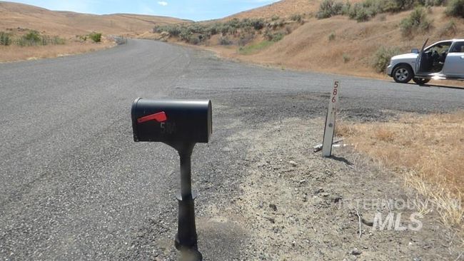 View of asphalt road featuring a mountain view | Image 6