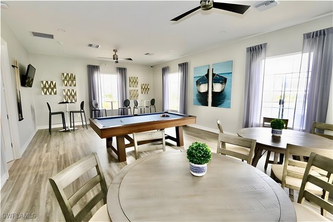 Playroom with a ceiling fan, baseboards, light wood-style flooring, and billiards table | Image 27