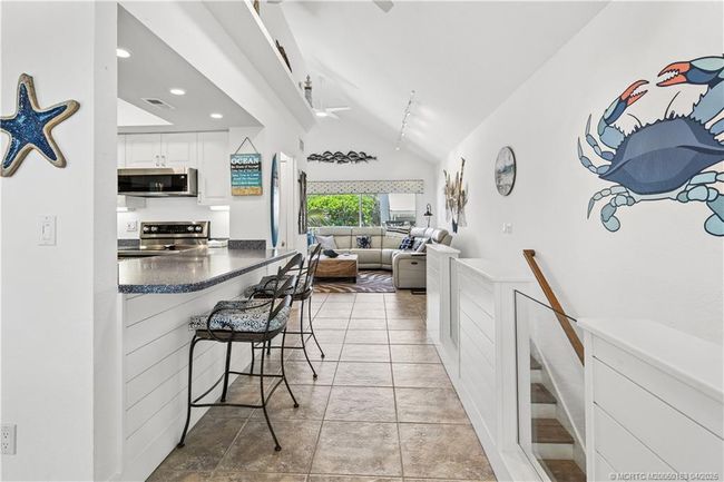 View of kitchen and living area taken from the dining room | Image 4
