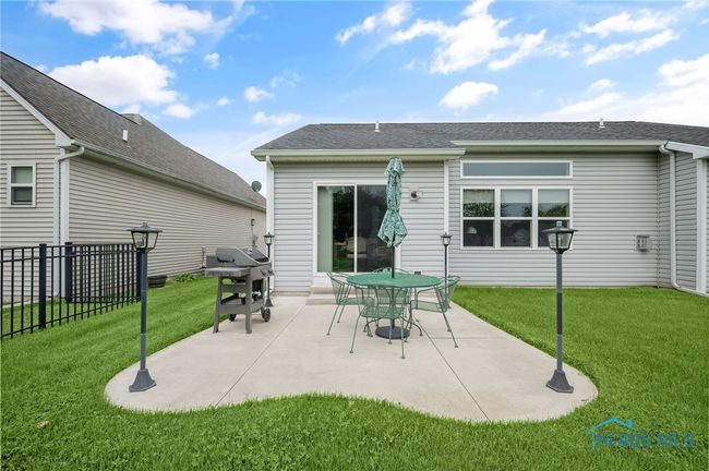 The unique concrete patio has custom lighting and space for entertaining. | Image 21