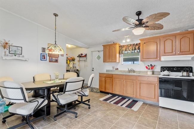 Kitchen with eat in area | Image 8