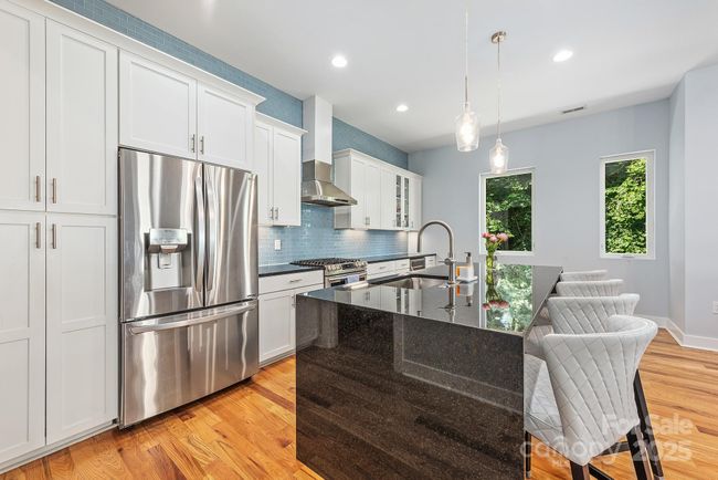Kitchen with large island | Image 12