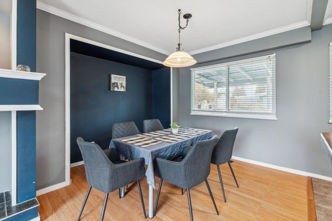 Dining area with baseboards, ornamental molding, and wood finished floors | Image 8