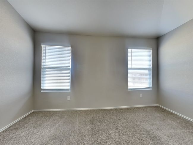 Empty room featuring carpet and baseboards | Image 7