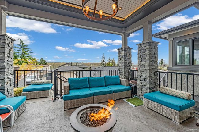 View of patio featuring an outdoor living space with a fire pit and a balcony | Image 10
