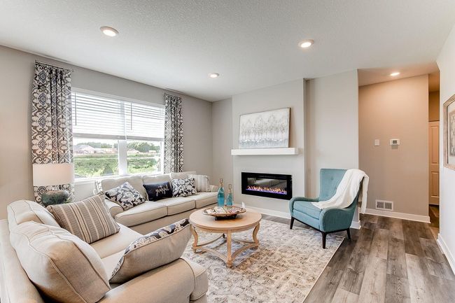 Large living room is perfect for gathering in. Photo of model home, color & options may vary. | Image 7