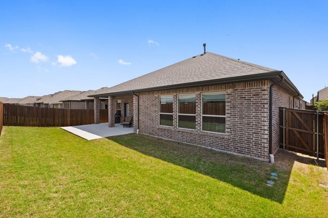 Covered back patio and extended patio - fully landscaped and full sprinkler system for easy maintenance. | Image 32