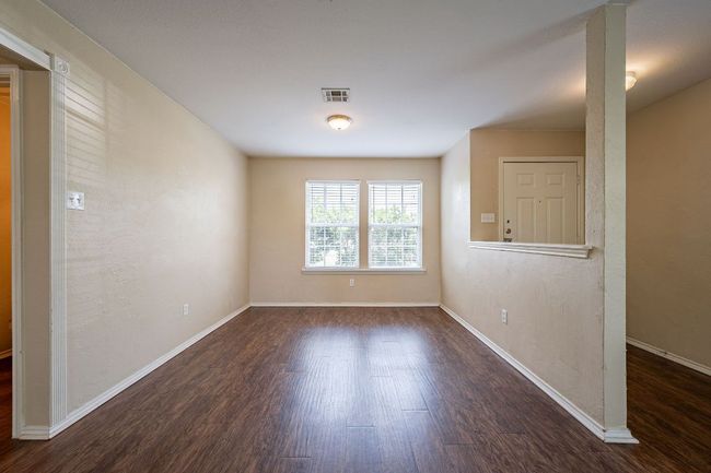 Empty room with wood finished floors and baseboards | Image 8
