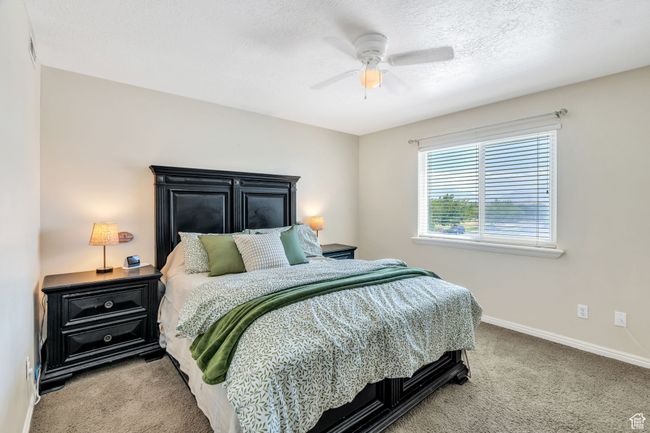 Carpeted bedroom with baseboards and ceiling fan | Image 8