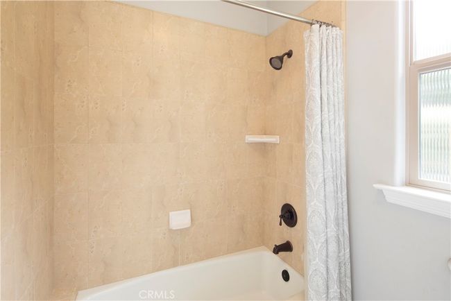 Shower/tub separated from the vanity in the guest bathroom | Image 40
