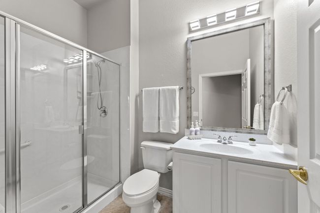 Full bathroom with toilet, a stall shower, and vanity | Image 36