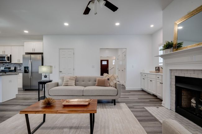 IMPRESSIVE Great Room w/ Gas Fireplace + Open Concept Design | Image 10