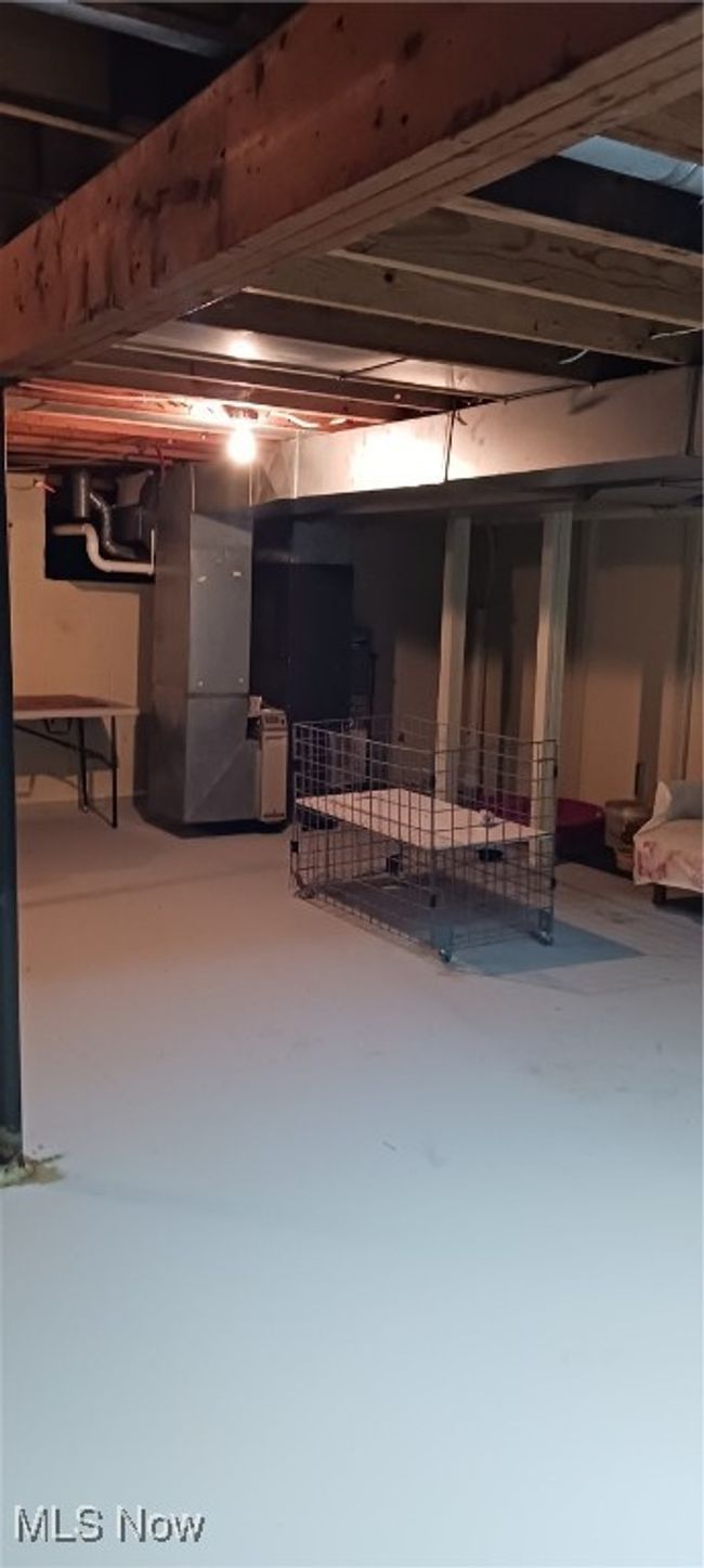 Unfinished basement with heating unit | Image 34