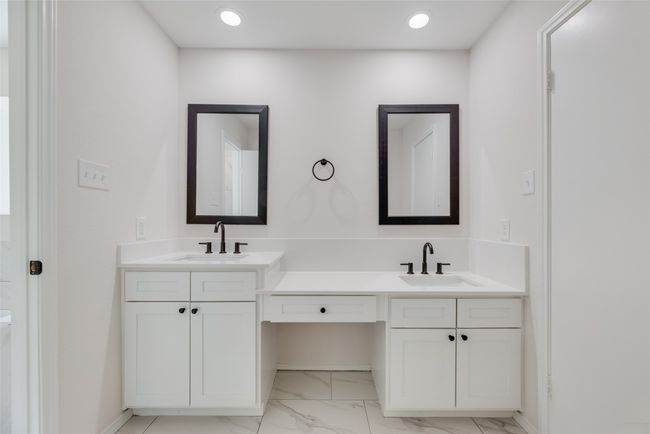 Full bath with vanity and marble look tiles | Image 13