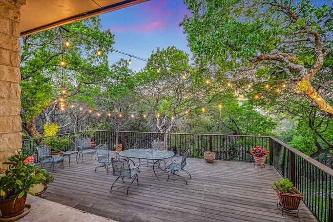 Deck at dusk with outdoor dining space | Image 14