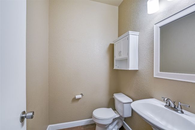 Half bath with a sink and toilet | Image 17