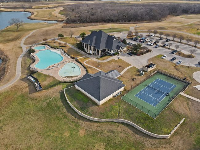 Aerial view of property and surrounding area featuring a large body of water and a pool area | Image 12