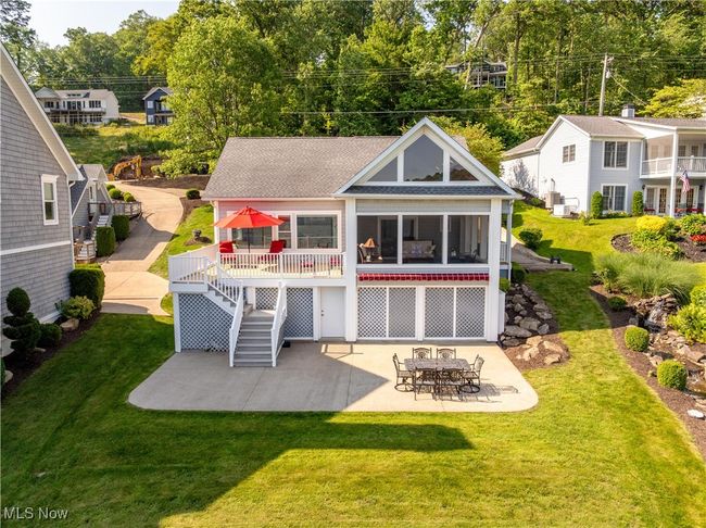 Front view of house with a patio, stairway, roof with shingles, a wooden deck, and a yard | Image 20