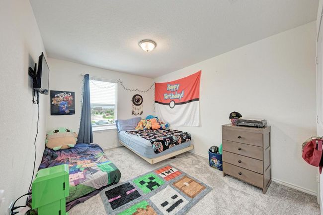 Carpeted bedroom with baseboards | Image 27