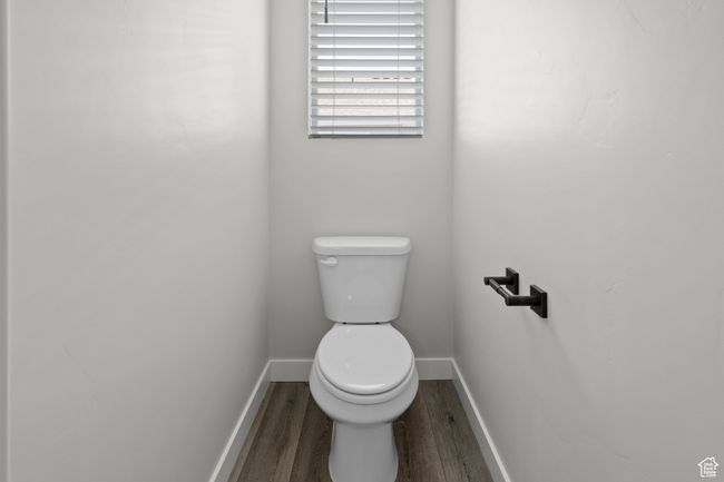 Bathroom featuring wood finished floors and toilet | Image 21