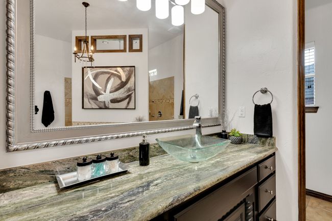 Bathroom featuring vanity, custom sinks. and an inviting chandelier | Image 16