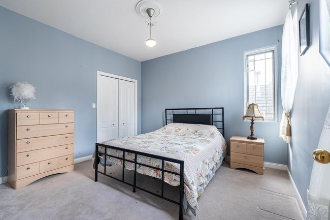 Bedroom featuring a closet, carpet floors, and baseboards | Image 27