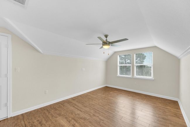 Bonus room with lofted ceiling, ceiling fan, and wood finished floors | Image 31