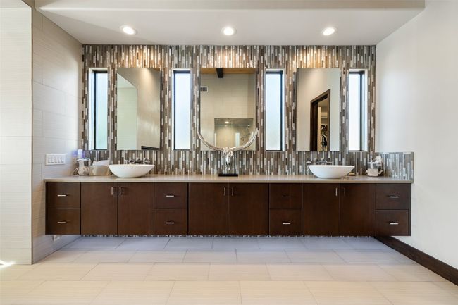 Full bath featuring double vanity, healthy amount of natural light, and recessed lighting | Image 7
